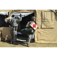 US Air Force soldier exits a medical facility with supplies Canvas Art - Stocktrek Images (35 x 23)