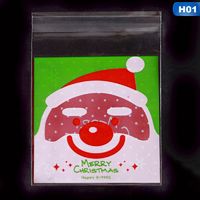 AkoaDa 100Pcs Christmas Bag Santa Claus Cellophane Gift Cookie Candy Self Adhesive Candy Gifts Bag 7X7+3Cm
